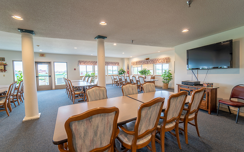 Northview Manor Community room with large TV and tables